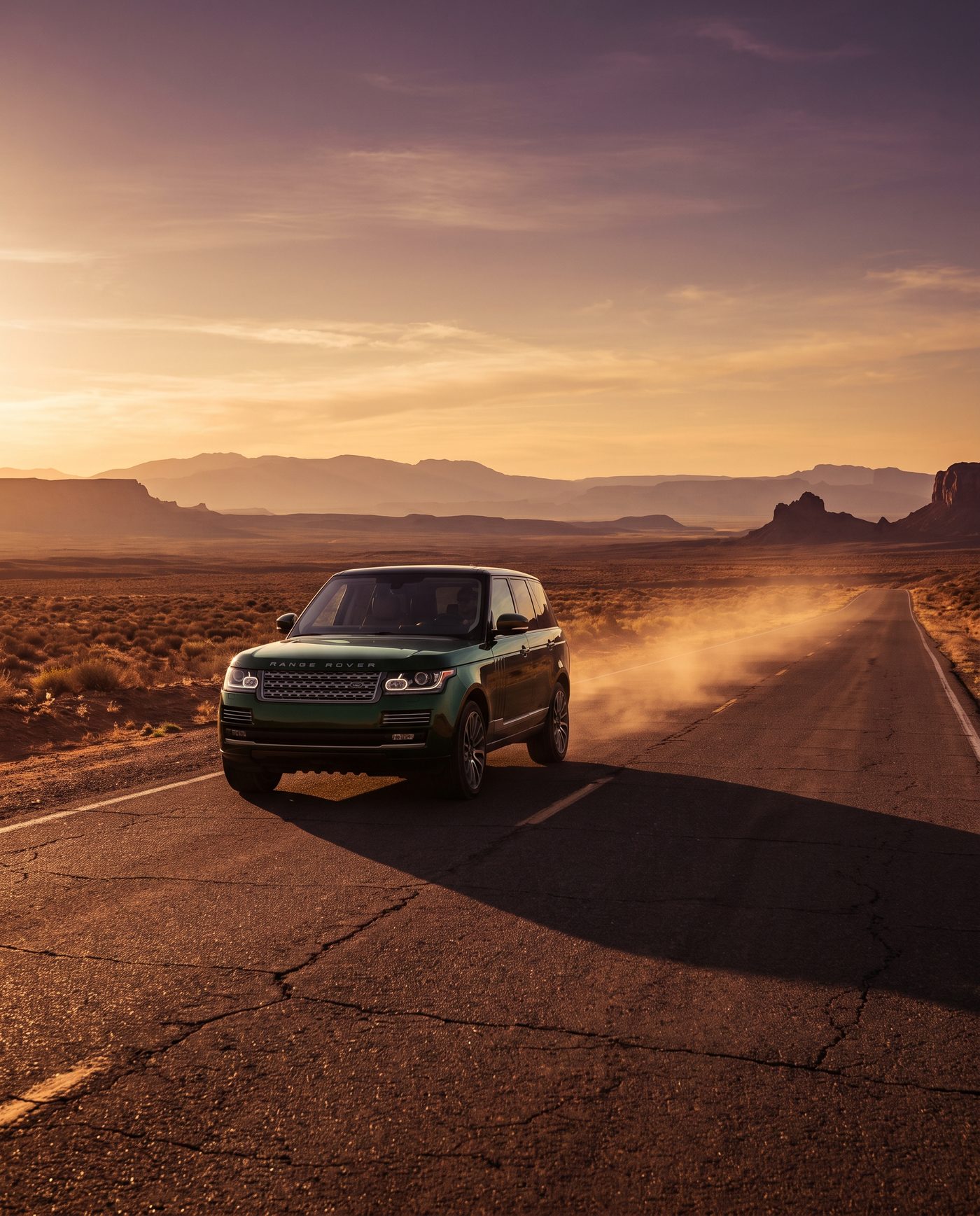2023 Range Rover Autobiography in dark green on an empty desert highway at golden hour